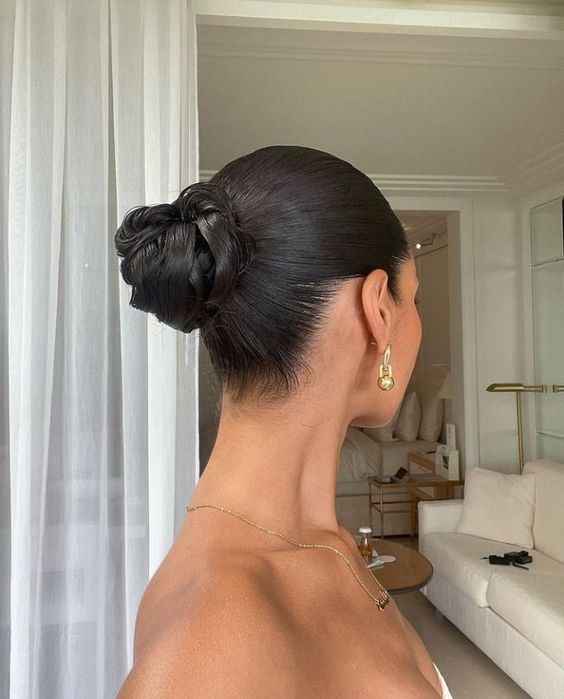 A woman with long hair in a bun, Quinceanera
