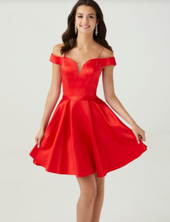 A fashion model in a red dress posing for the camera, wearing a T-shirt