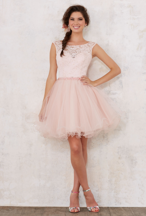 Quinceañera dresses, a woman in a pink dress posing for a picture