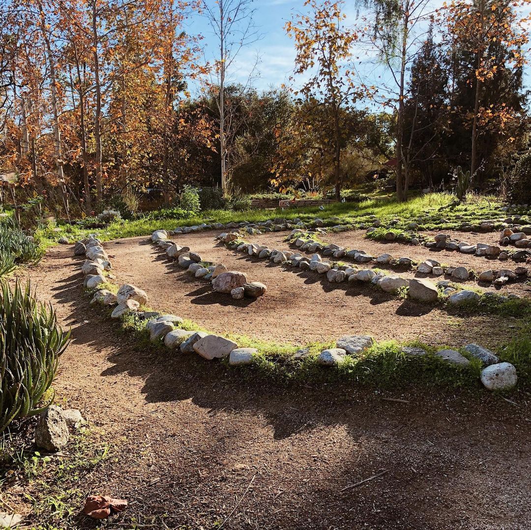 Quinceanera image description: A stunning landscape of the Arlington Garden in Pasadena. The circular garden showcases a charming display of rocks and vibrant plants at its center.
